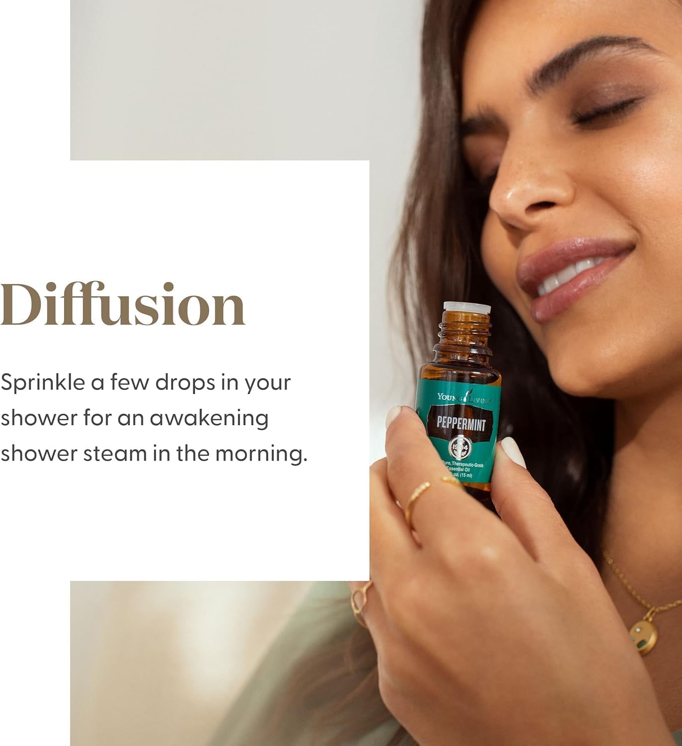 Woman holding a bottle of Young Living Peppermint essential oil with text about diffusing it.