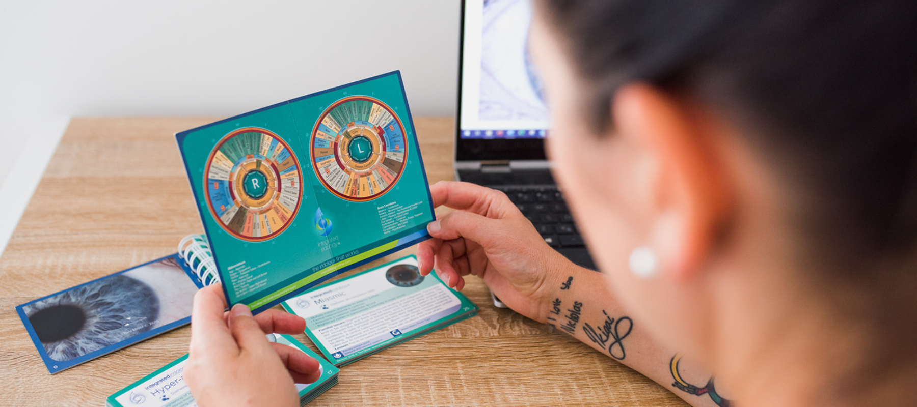 Iridology & Sclerology – Diane Hackner reviewing an iridology chart – book an appointment.