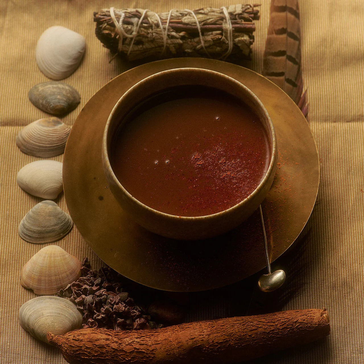 Ceremonial cup of Loco Love Chuncho Drinking Cacao – rich, frothy cacao elixir prepared from 100% wild Chuncho Sun Disc for mindful wellness and ritual use.