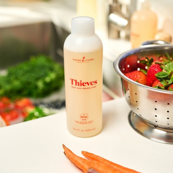 Thieves Fruit & Veggie Soak natural produce wash with fresh fruit and vegetables for removing residue and cleaning produce safely.