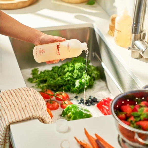 Thieves Fruit & Veggie Soak essential oil produce cleaner used for washing fruit and vegetables to remove dirt and surface contaminants.