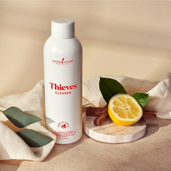 Thieves Household Cleaner diluted in spray bottle for natural home cleaning and removing dirt and grime.