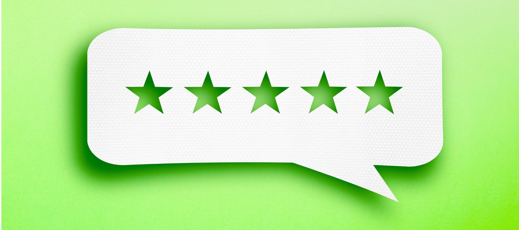 Five green stars inside a white speech bubble on a green background