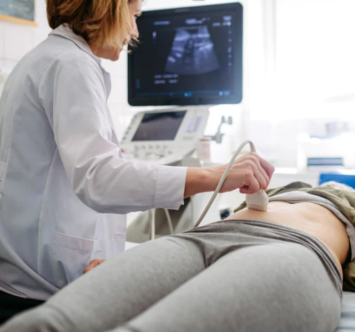 Doctor performing an ultrasound on a patient in a medical setting