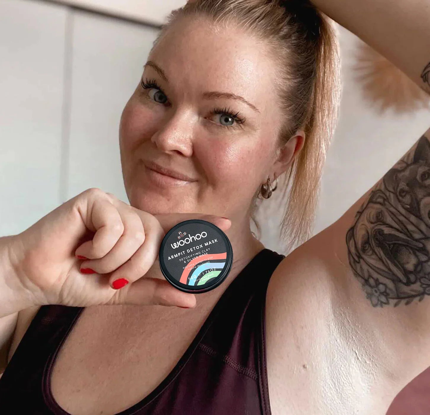 Customer holding Woohoo Body Armpit Detox Mask underarm detox clay mask supporting natural deodorant transition and helping reduce underarm odour.