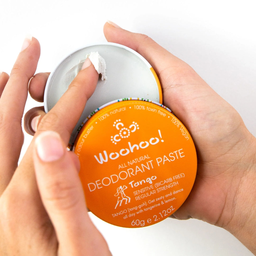 Open tin of Woohoo Body Tango natural deodorant paste showing creamy smooth texture for sensitive skin.
