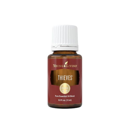 Young Living Thieves Essential Oil 15ml amber bottle blend with clove, lemon, cinnamon, eucalyptus and rosemary oils front label.