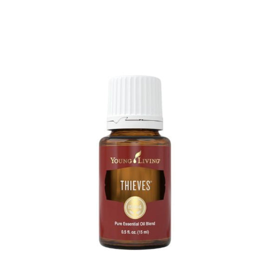 Young Living Thieves Essential Oil 15ml amber bottle blend with clove, lemon, cinnamon, eucalyptus and rosemary oils front label.